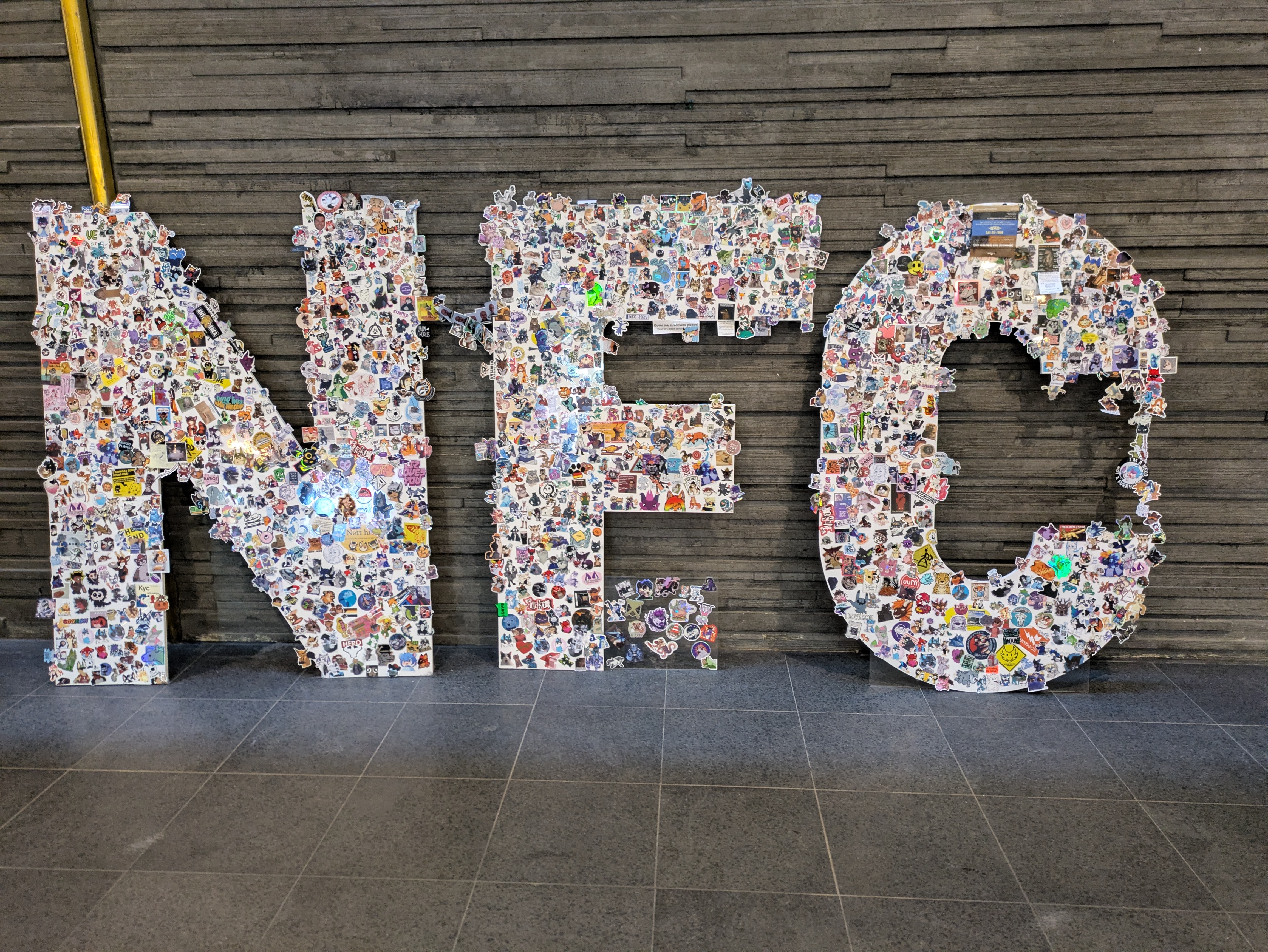 NFC sign covered in a thick layer of stickers